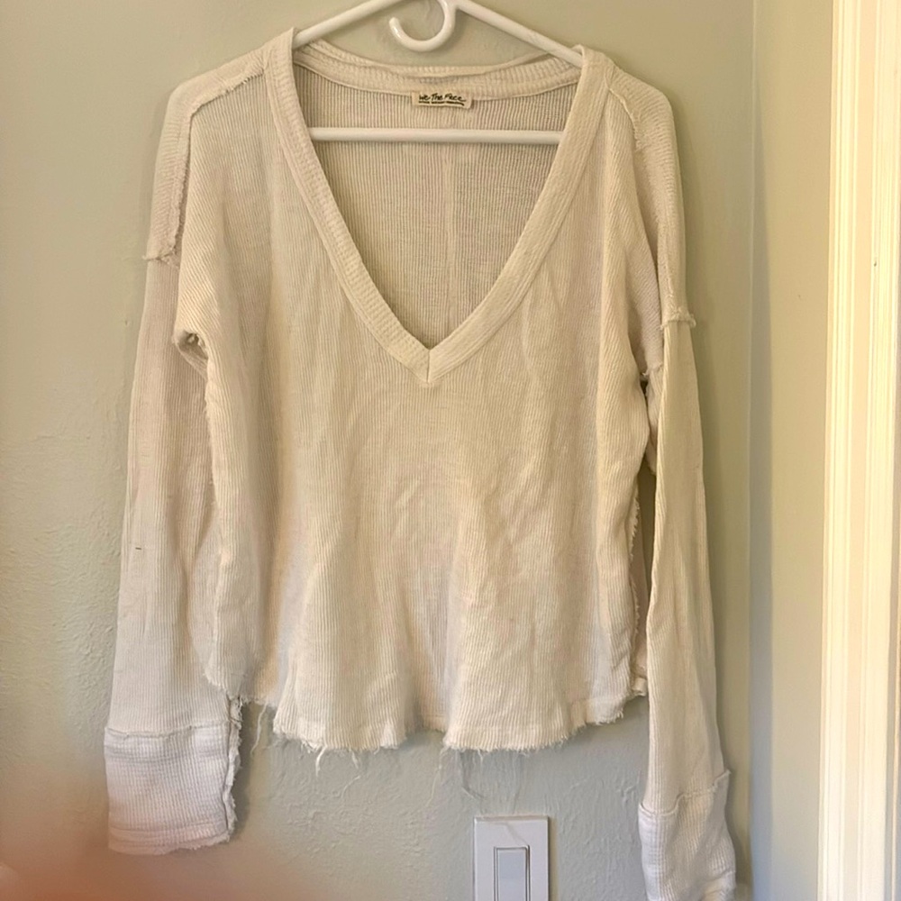 We the free/Free people white deep V long sleeve with intentional fraying.